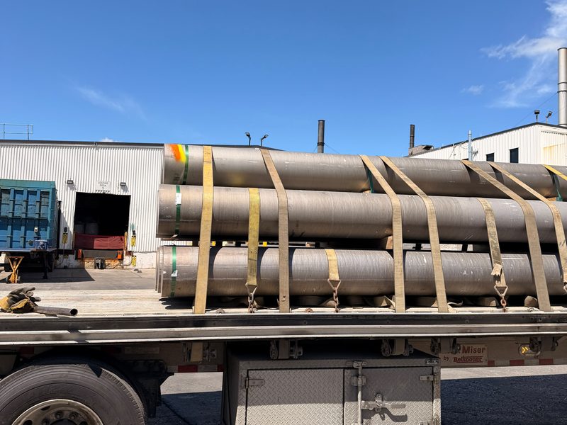 Large steel pipe strapped on a Fission flatbed