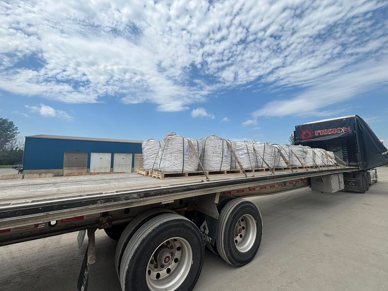 Bulk bags of stone strapped on a Fission flatbed